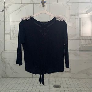 A navy blue top with crisscross back